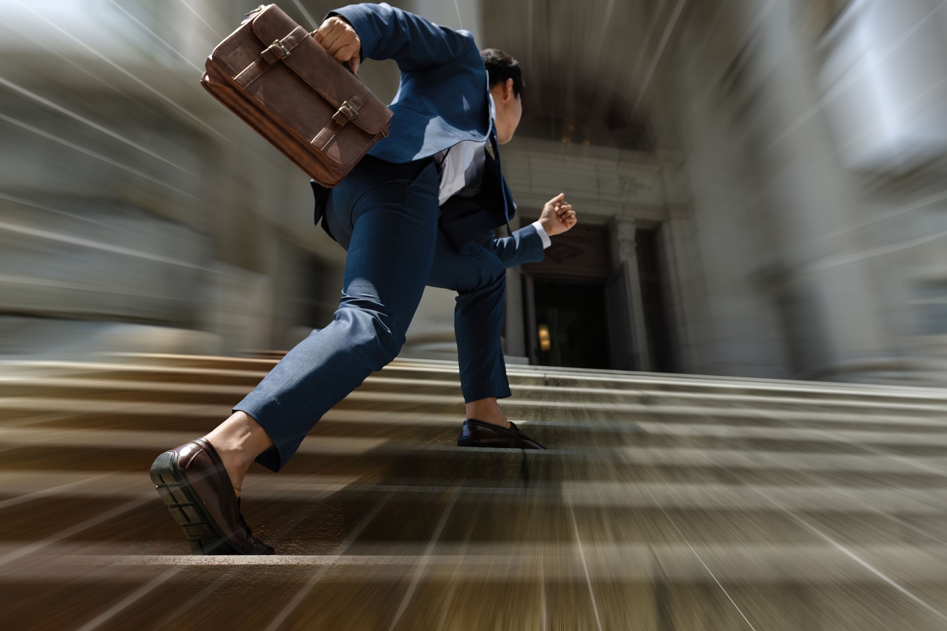 Businessman with briefcase stepping up the stairs quickly for get fund and loan, Busy man is in a hurry, time is money, Business