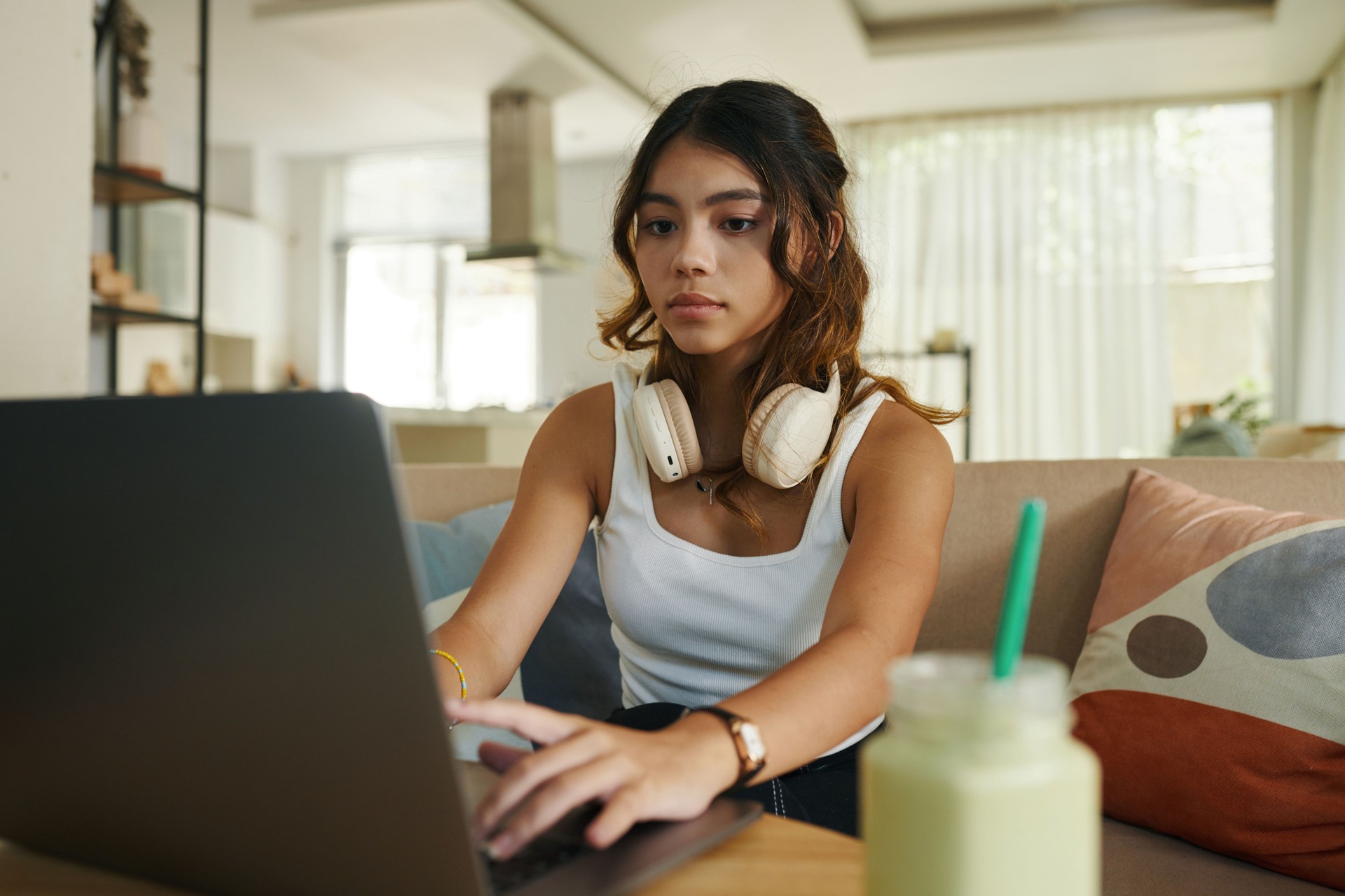 Teenage Girl Working on Laptop